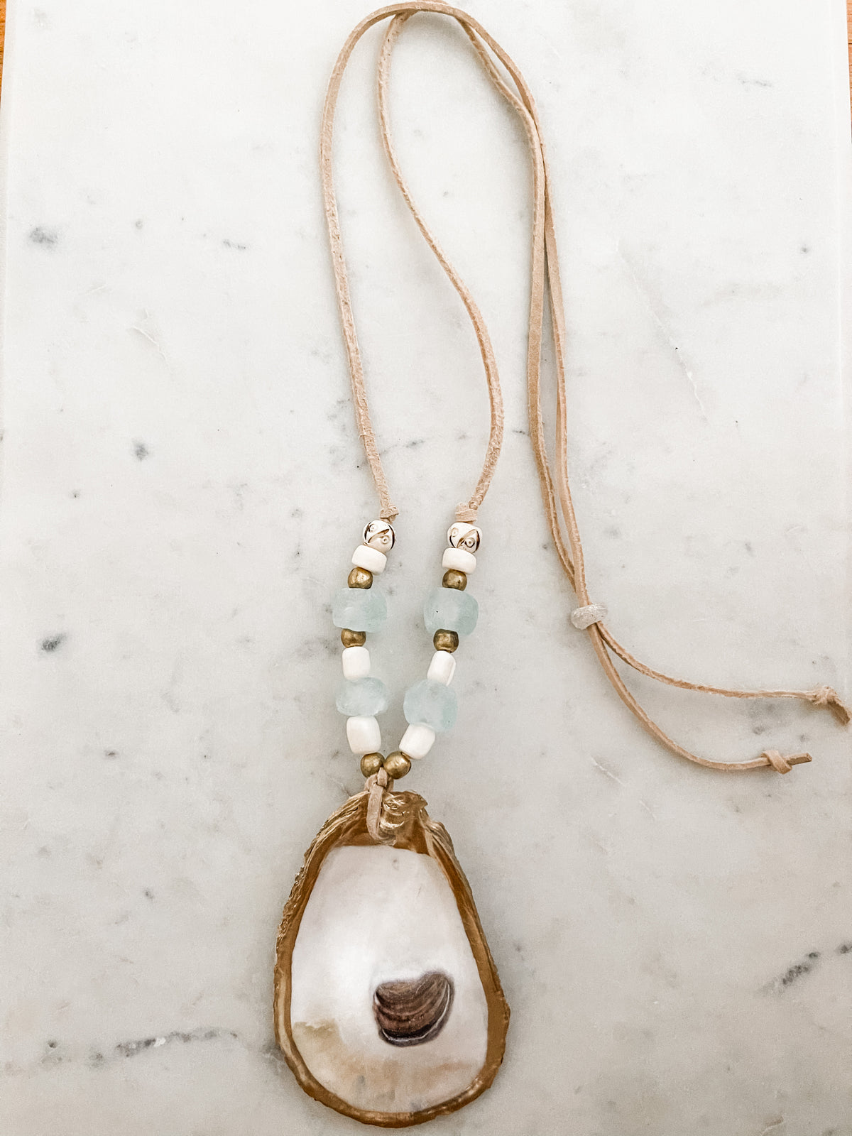 OYSTER SHELL ON LEATHER
